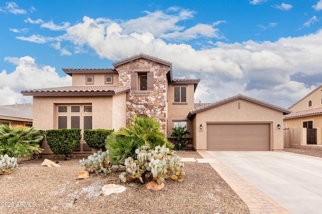 mediterranean / spanish house featuring a garage