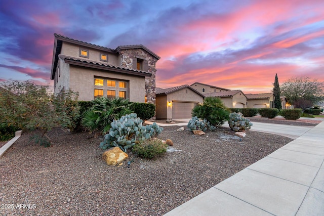 mediterranean / spanish-style home featuring a garage