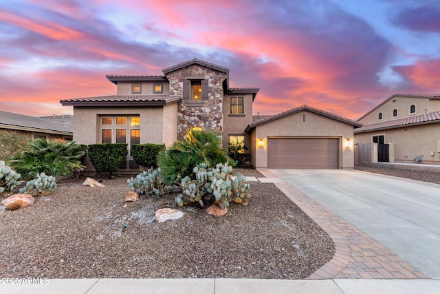 mediterranean / spanish-style house featuring a garage