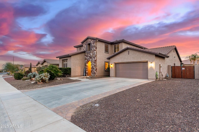 mediterranean / spanish-style home featuring a garage