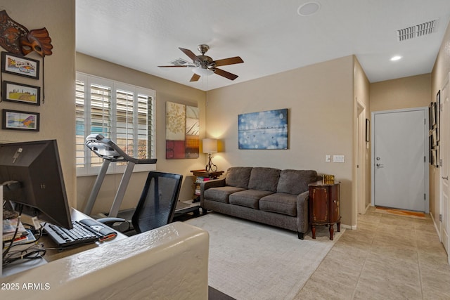 tiled living room with ceiling fan