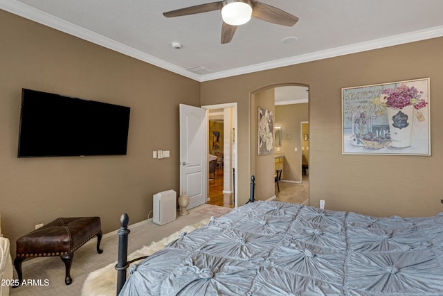 bedroom with crown molding, light colored carpet, and ceiling fan