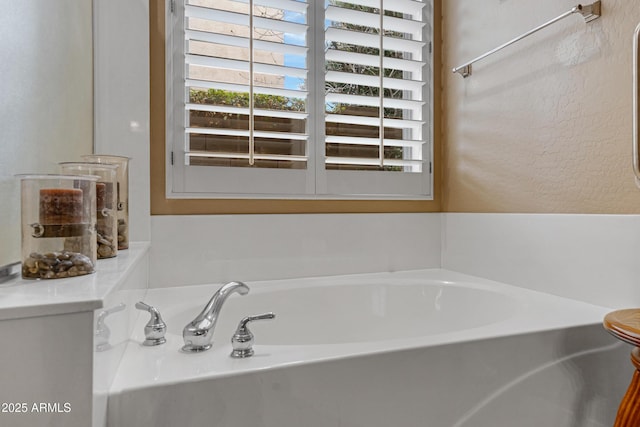 bathroom with a washtub