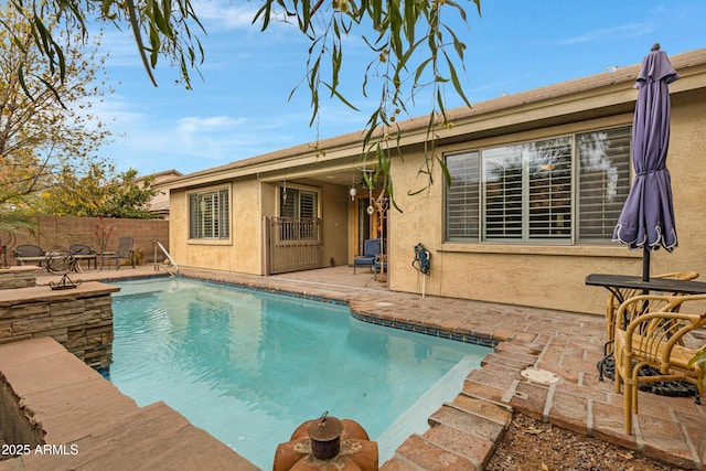 view of pool featuring a patio area