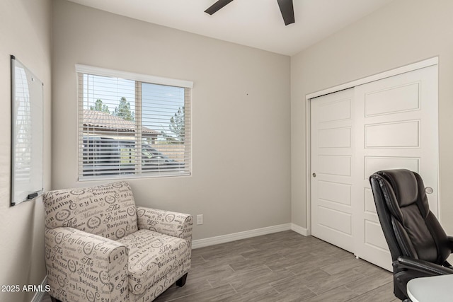 office with ceiling fan, baseboards, and wood finished floors