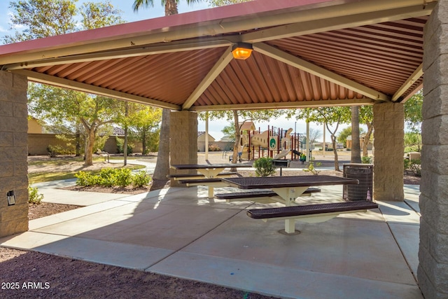 view of patio featuring playground community