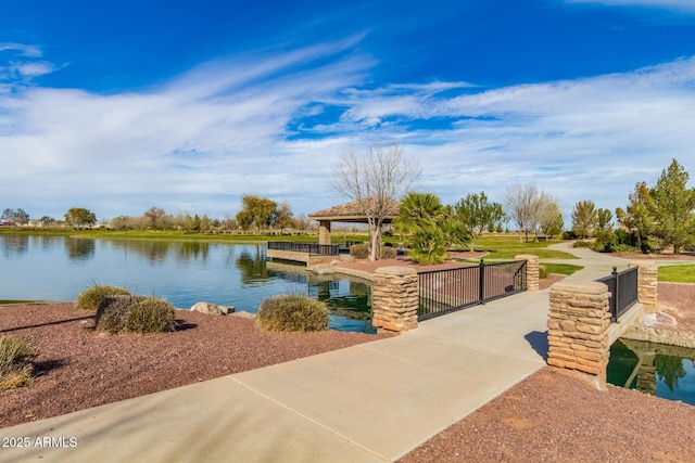 exterior space featuring a gazebo and a water view