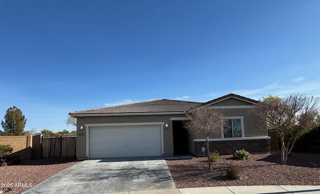 single story home featuring stucco siding, stone siding, and concrete driveway