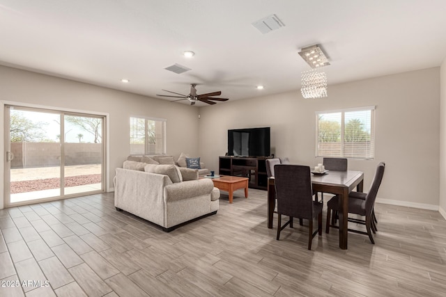 living area with recessed lighting, visible vents, and light wood finished floors