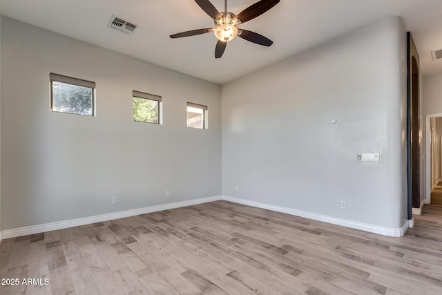 unfurnished room with ceiling fan and light wood-type flooring