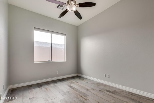 spare room with ceiling fan and light hardwood / wood-style flooring