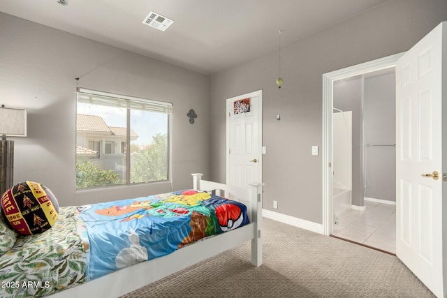 bedroom featuring carpet floors, visible vents, and baseboards