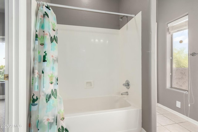 full bath with shower / tub combo with curtain and tile patterned floors