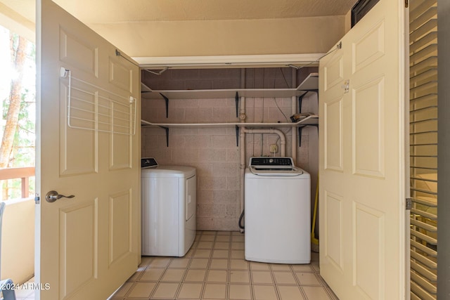 washroom featuring washing machine and dryer