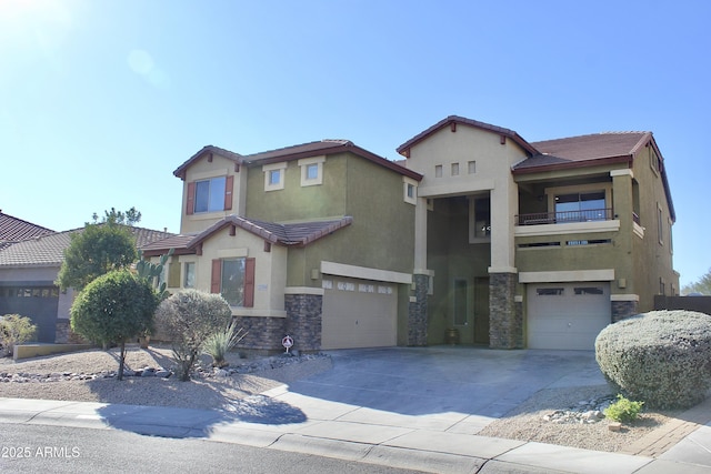 view of front of home with a balcony and a garage