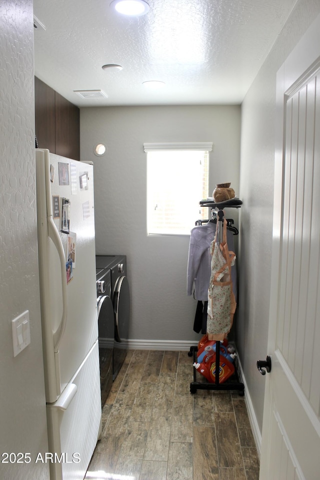 laundry room featuring washing machine and dryer