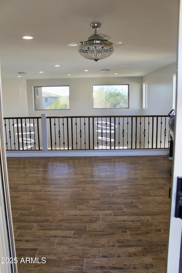 corridor with dark hardwood / wood-style flooring