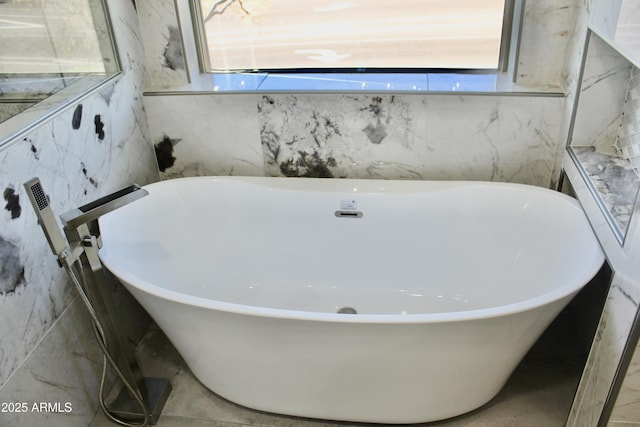 bathroom featuring a washtub