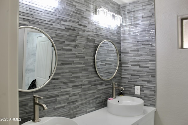 bathroom with backsplash and sink