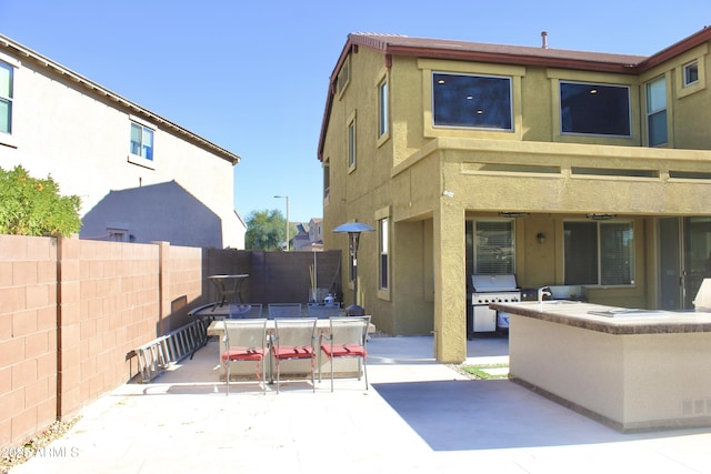 back of property featuring a patio