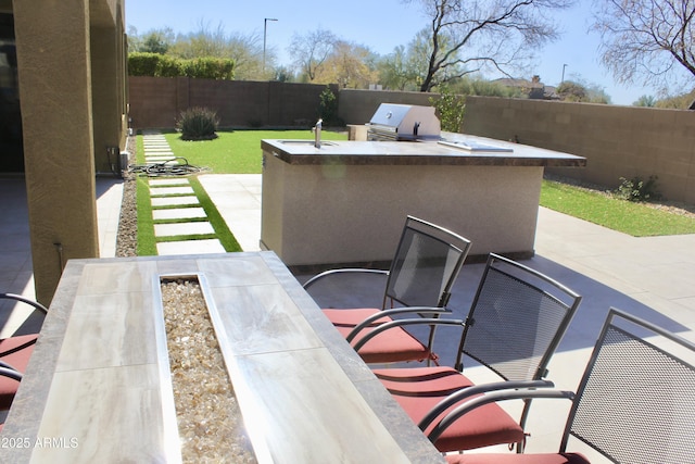 view of patio / terrace featuring an outdoor kitchen and grilling area