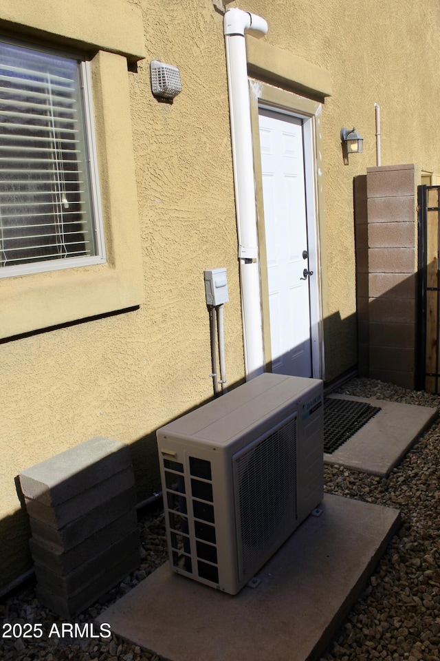 exterior space with ac unit