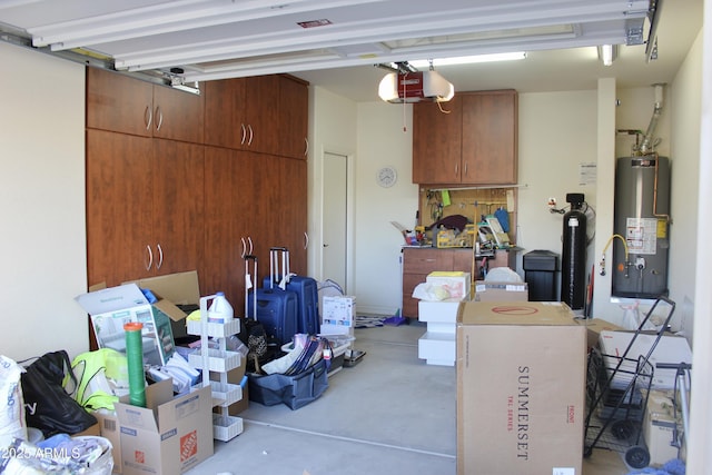 garage with a garage door opener and water heater