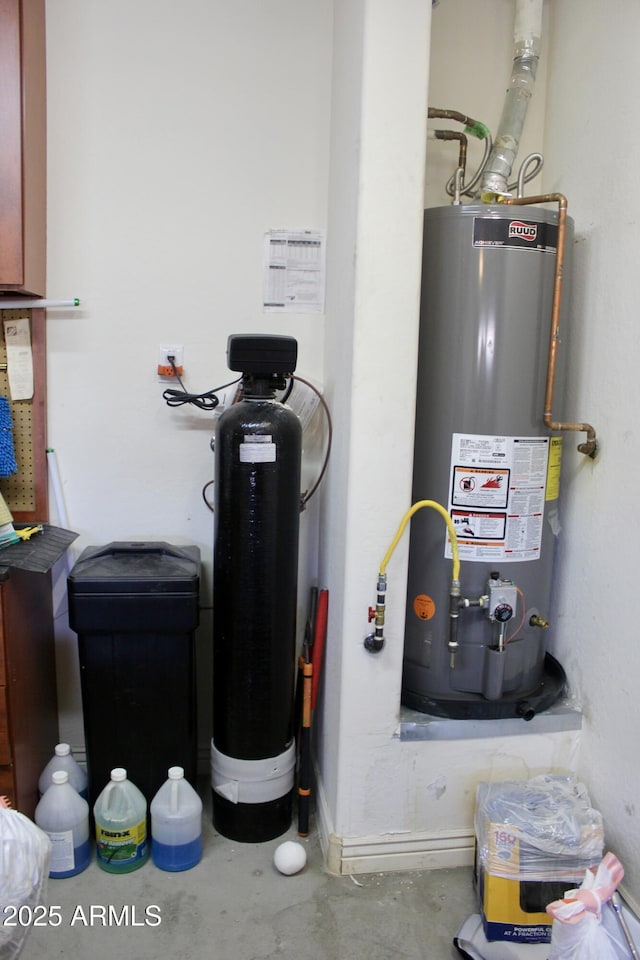 utility room featuring water heater