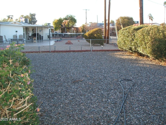 view of yard featuring fence and a patio