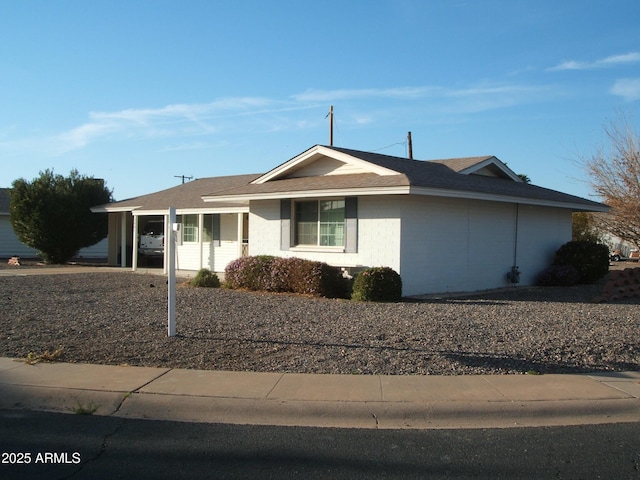 single story home with a carport