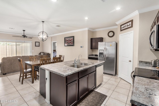 4556 E Gagarinite Ln, San Tan Valley, AZ 85143 - kitchen with a sink, open floor plan, ceiling fan, dark brown cabinets, and stainless steel appliances