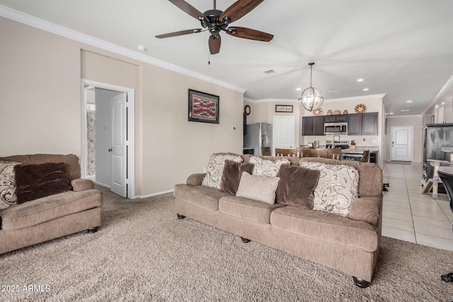 4556 E Gagarinite Ln, San Tan Valley, AZ 85143 - living area with crown molding, ceiling fan with notable chandelier, recessed lighting, light carpet, and baseboards