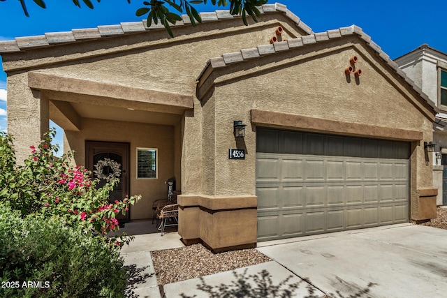4556 E Gagarinite Ln, San Tan Valley, AZ 85143 - view of front of house with an attached garage, concrete driveway, and stucco siding