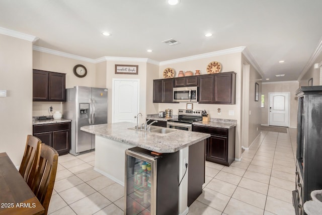 4556 E Gagarinite Ln, San Tan Valley, AZ 85143 - kitchen featuring visible vents, light tile patterned floors, appliances with stainless steel finishes, wine cooler, and dark brown cabinets