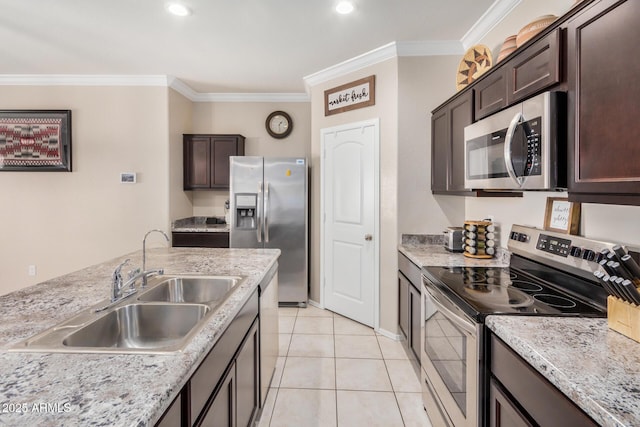 4556 E Gagarinite Ln, San Tan Valley, AZ 85143 - kitchen featuring light tile patterned floors, a sink, appliances with stainless steel finishes, dark brown cabinets, and crown molding