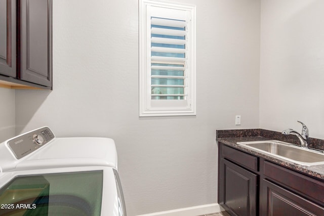 laundry room with sink, cabinets, and independent washer and dryer