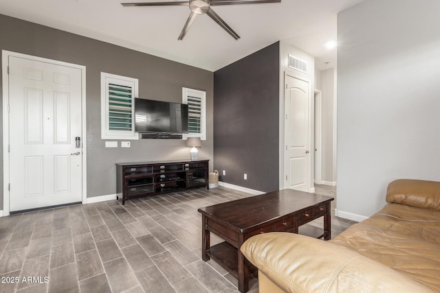 living room with ceiling fan and hardwood / wood-style floors