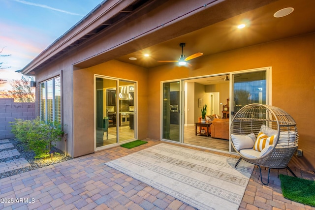 patio terrace at dusk with ceiling fan