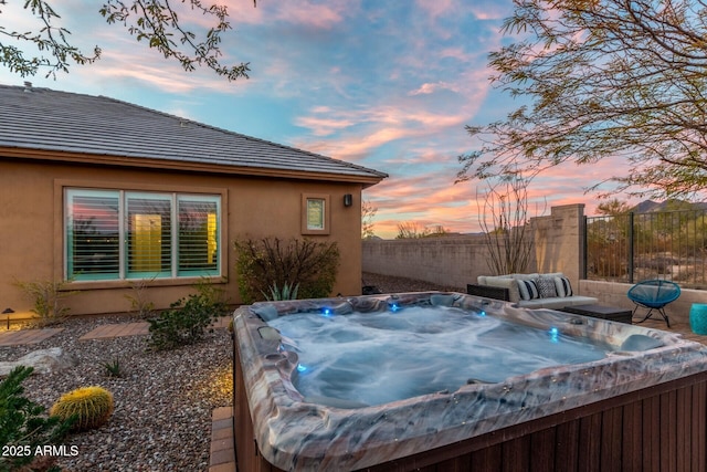 exterior space featuring a hot tub