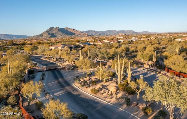 birds eye view of property with a mountain view