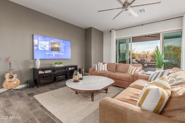 living room with ceiling fan and wood-type flooring