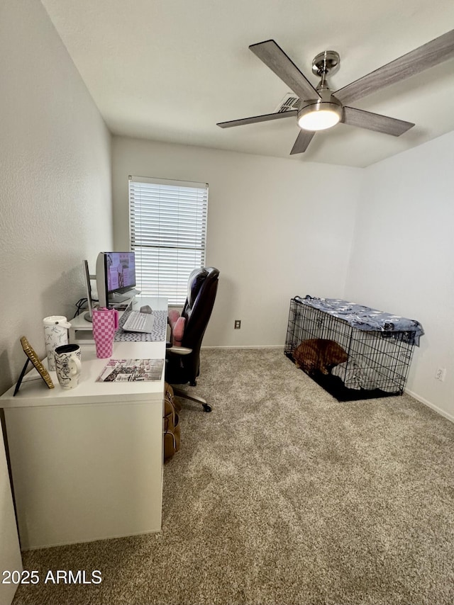 home office with ceiling fan and carpet flooring