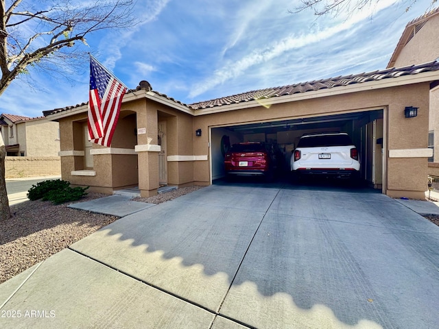 mediterranean / spanish house with a garage