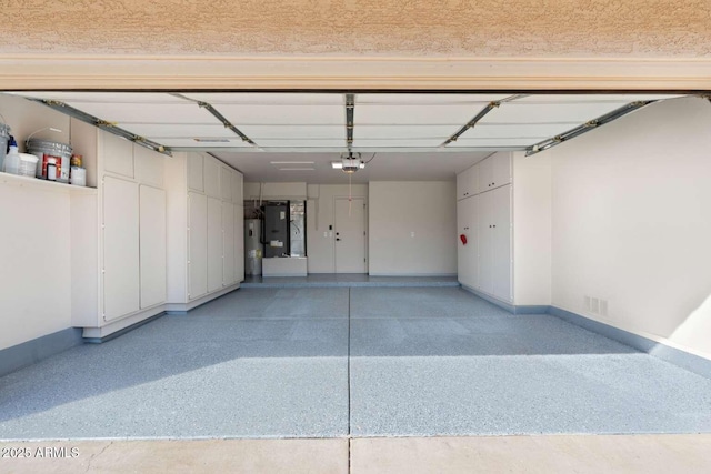 garage featuring a garage door opener and water heater