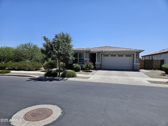 18871 S 209th Way, Queen Creek, AZ 85142 - view of front facade featuring an attached garage, driveway, stone siding, and a tile roof