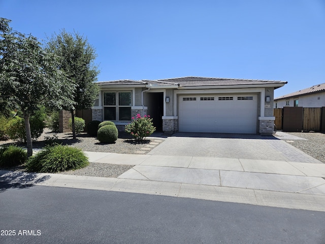 18871 S 209th Way, Queen Creek, AZ 85142 - prairie-style house with stone siding, driveway, an attached garage, and stucco siding
