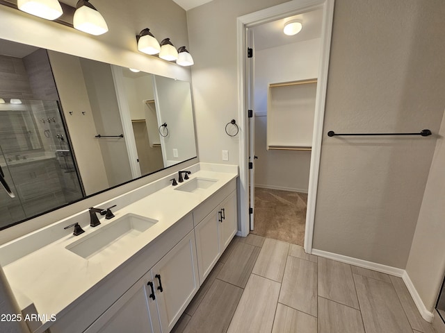 18871 S 209th Way, Queen Creek, AZ 85142 - bathroom featuring a spacious closet, double vanity, and a shower stall