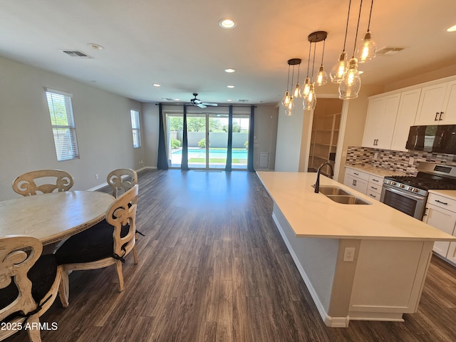18871 S 209th Way, Queen Creek, AZ 85142 - kitchen featuring gas range, black microwave, dark wood-style floors, ceiling fan, and recessed lighting
