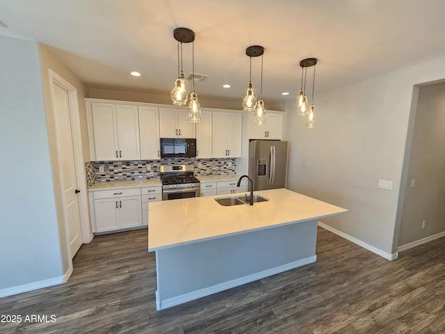 18871 S 209th Way, Queen Creek, AZ 85142 - kitchen with appliances with stainless steel finishes, tasteful backsplash, a kitchen island with sink, dark wood finished floors, and recessed lighting