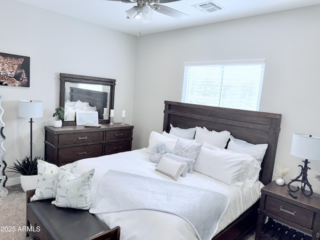 bedroom featuring visible vents, ceiling fan, and carpet floors